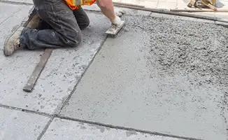 Professional repairing a concrete floor in Albuquerque, NM